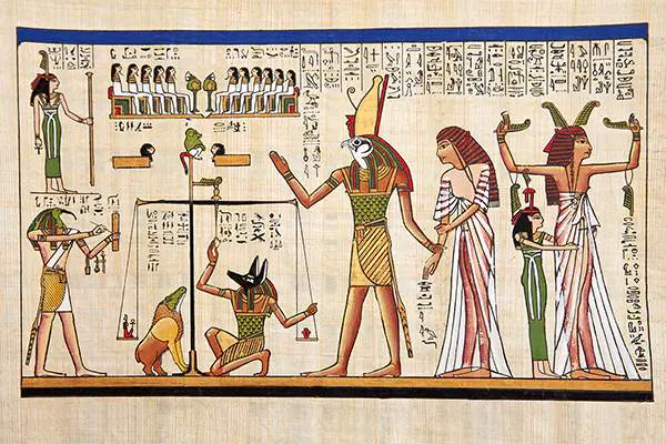 Egyptian Anubis (with dog head) weighing heart of dead Osiris and Isis look on